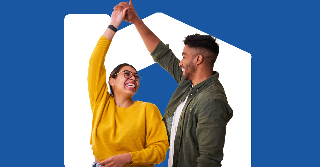 A couple smiling while dancing.